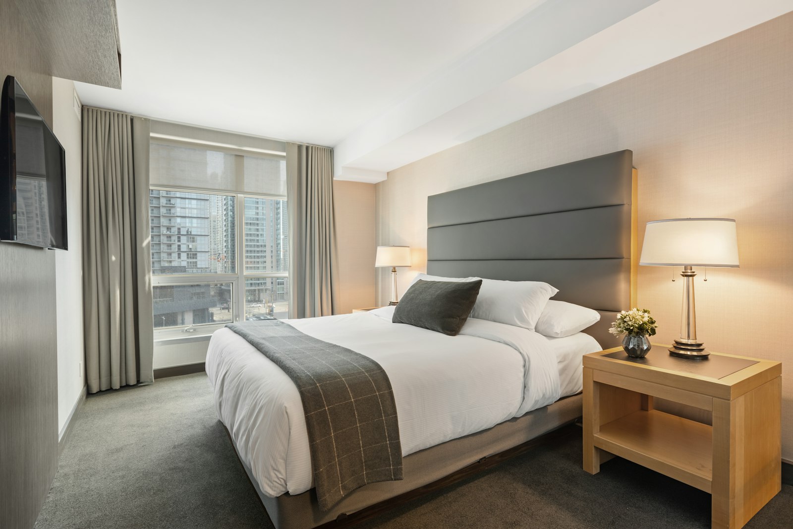 Calm hotel bedroom with soft natural light